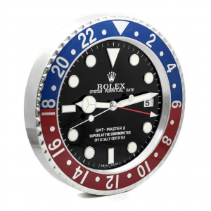 Rolex wall clock. Wall clock is in the style of a Rolex 'Pepsi' wristwatch. Black dial with a red/blue & stainless steel bezel.