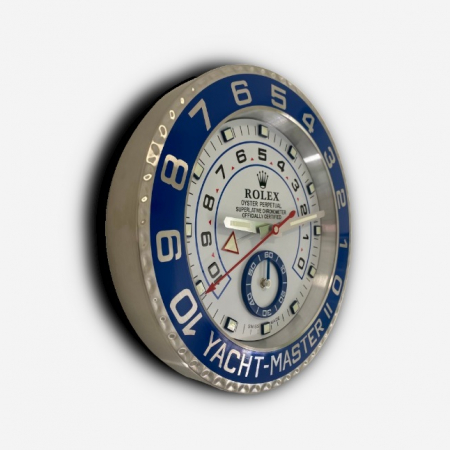 Rolex wall clock. Wall clock in the style of a Rolex Yacht-Master II wristwatch with a white dial, silver hands, blue sub dial and a blue & stainless steel bezel.