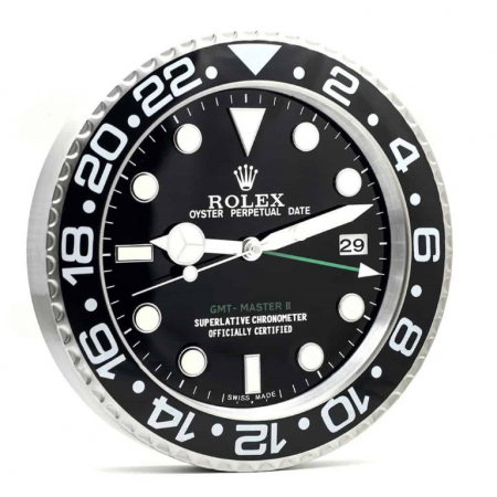Rolex wall clock. Wall clock in the style of a black dial stainless steel Rolex GMT Master II wristwatch.