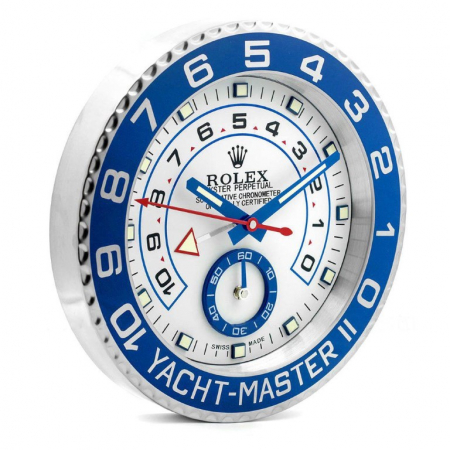 Rolex wall clock. Wall clock is in the style of a Rolex Yacht-Master II wristwatch with a white dial, Blue hands, blue sub dial and a blue & stainless steel bezel.